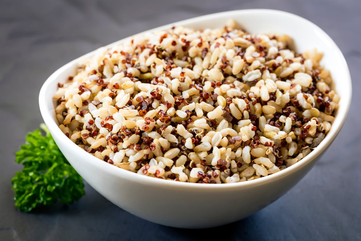 Brown Rice and Quinoa in White Bowl over Slate