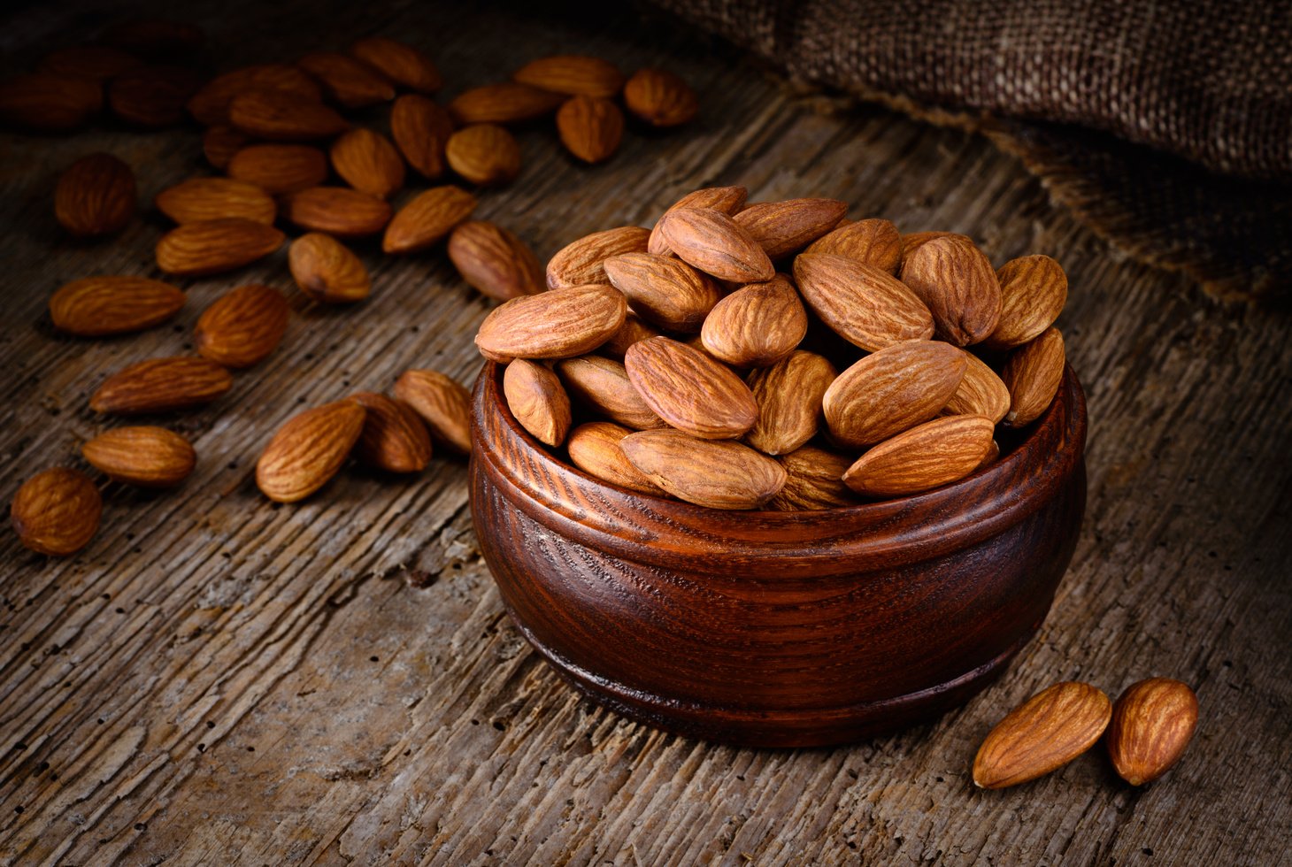 Almond. Almonds on wooden table. Almonds background.