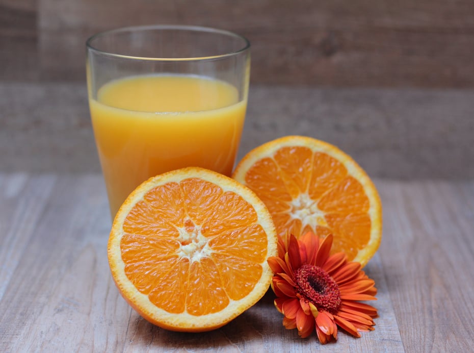 Orange Juice Glass on Wooden Background