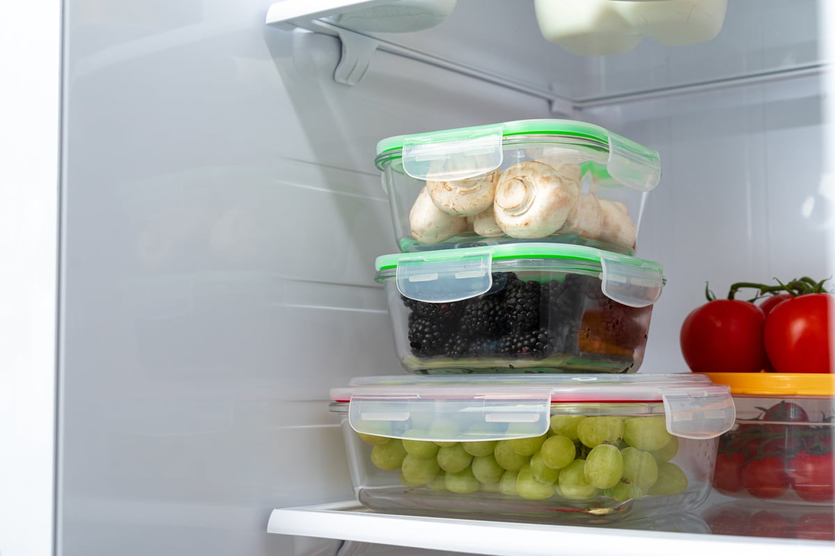 Storage containers with fresh food in a fridge