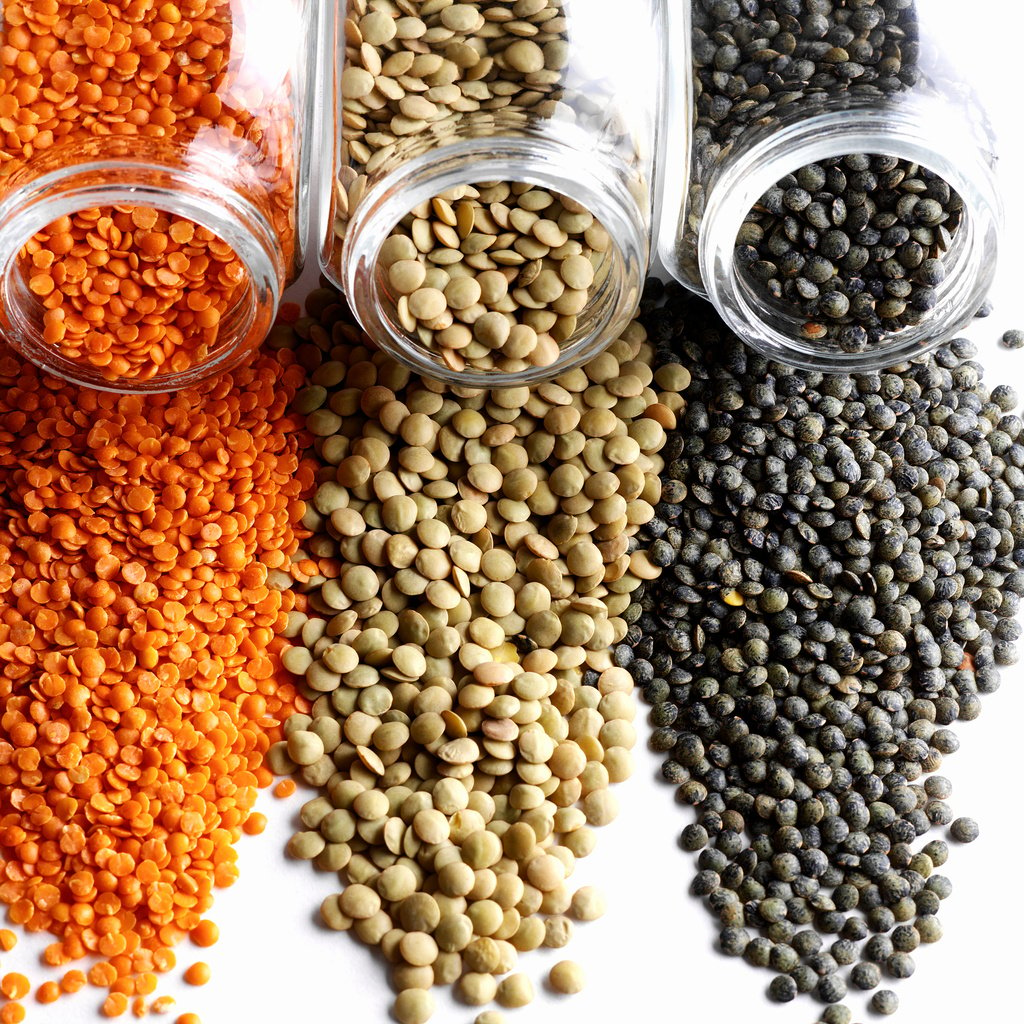 Lentils spilling from glass jars