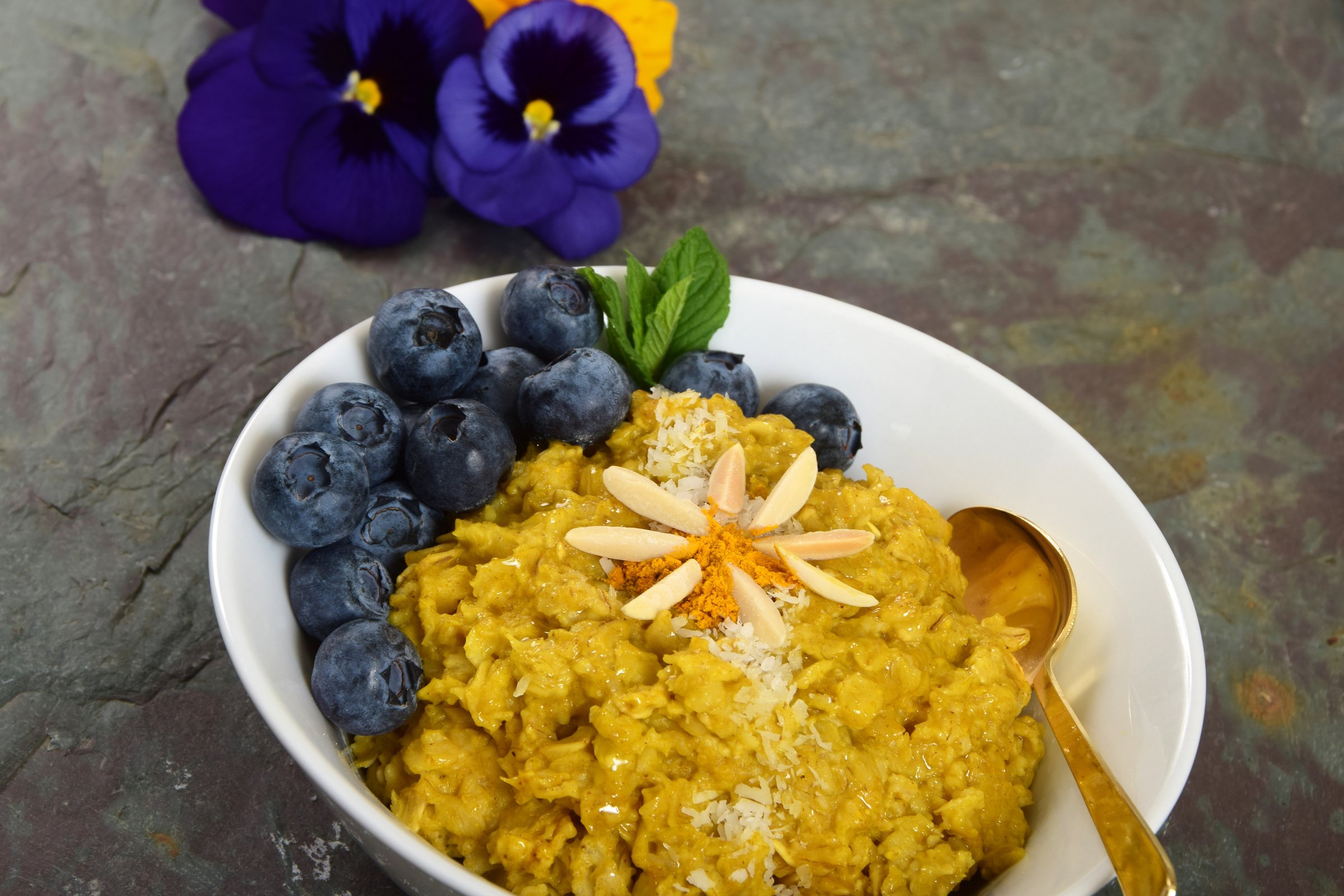 Turmeric Oatmeal Bowl with Blueberries, Coconut, and Almonds