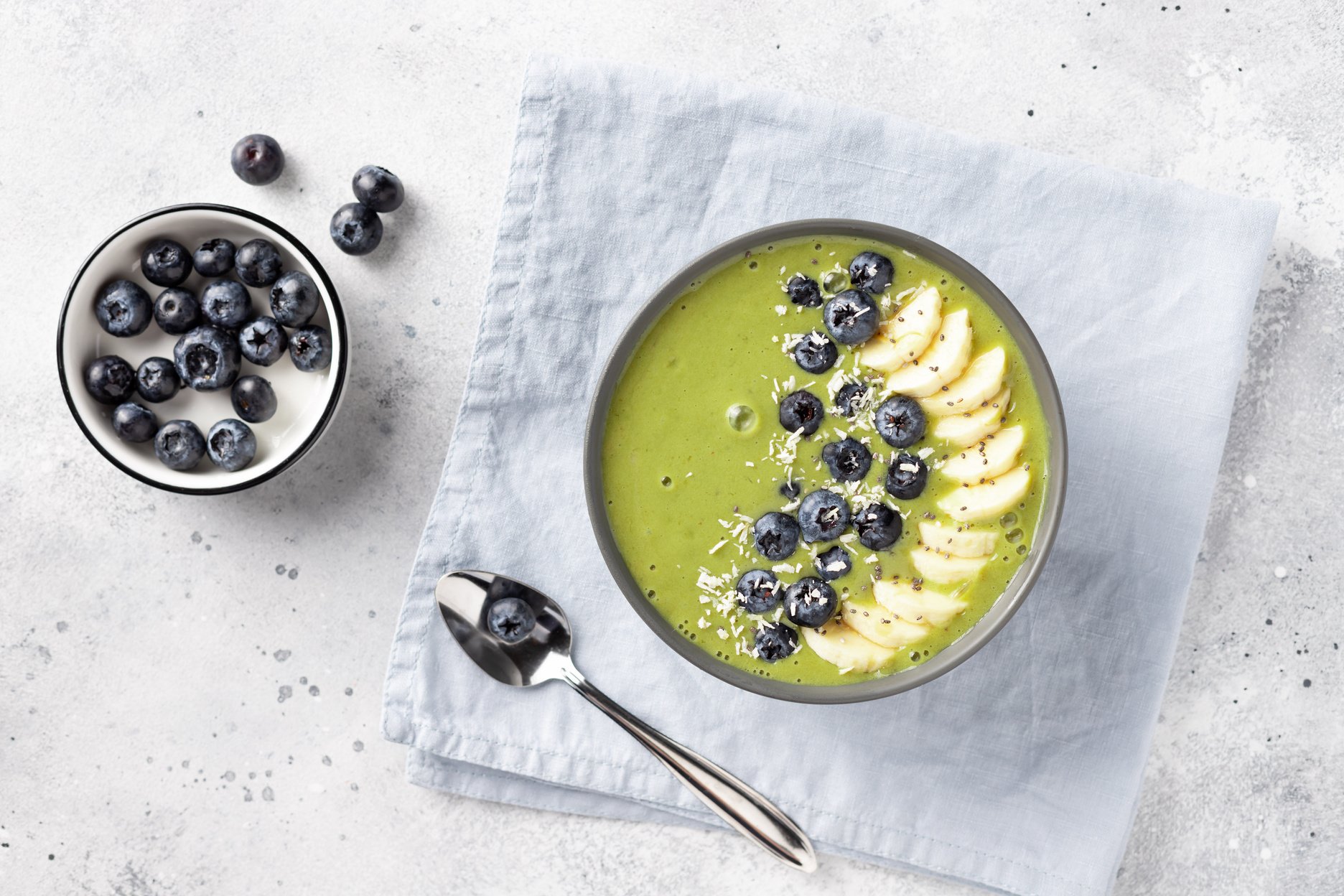 matcha green tea smoothie bowl with banana, almond milk, blueberries