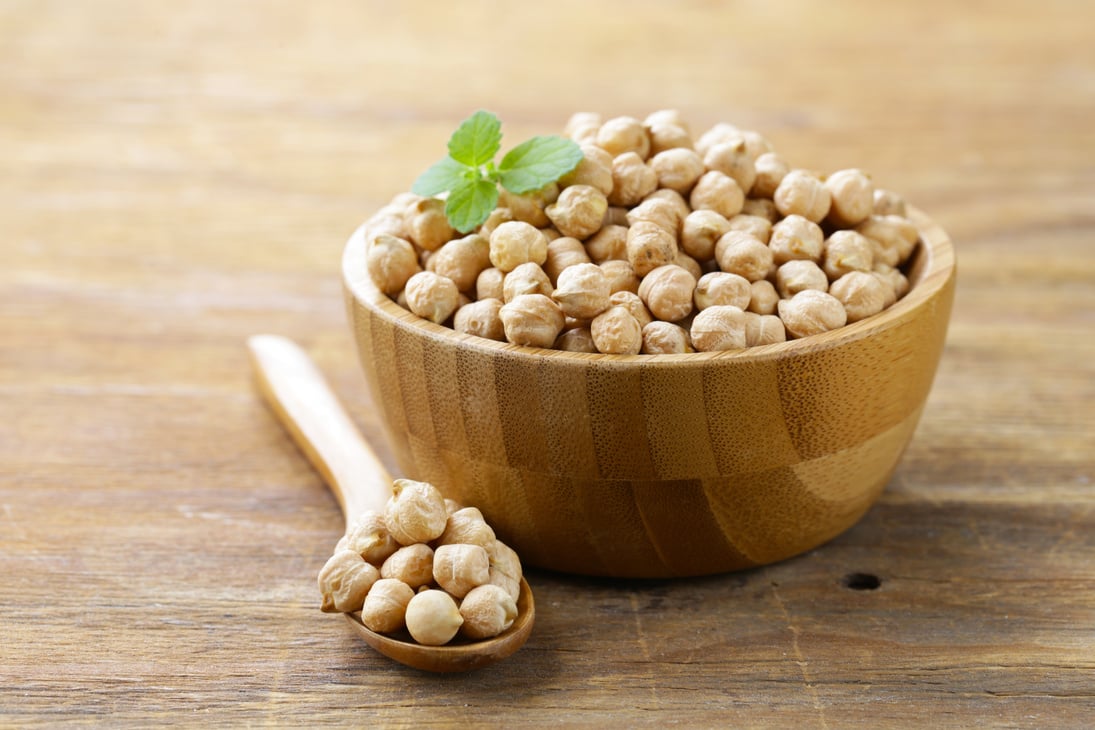 Raw Chickpeas in a Wooden Bowl